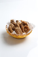 deep fried crispy chicken meat in basket in white black background dim sum snack halal menu