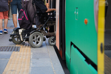 handicapped person getting into a wheelchair on the metro. The photo shows how he can access the...