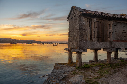 stone barn called h&oacute;rreo typical of the area of Galicia, located in the R&iacute;as Baixas at sunset.