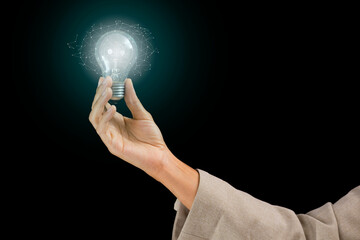 Woman Hands holding light bulb - symbols of idea, creative thinking, innovations and intelligence.