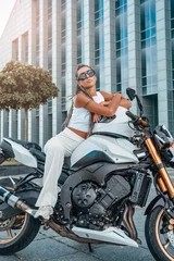 Foto op Plexiglas Woman dressed in stylish clothing sitting on motorbike © Fxquadro