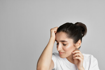 Fototapeta premium woman in white t-shirt headache problems negative