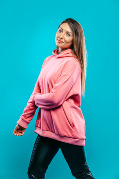 Beautiful Woman Wearing Pink Tracksuit Sweater Posing On Studio