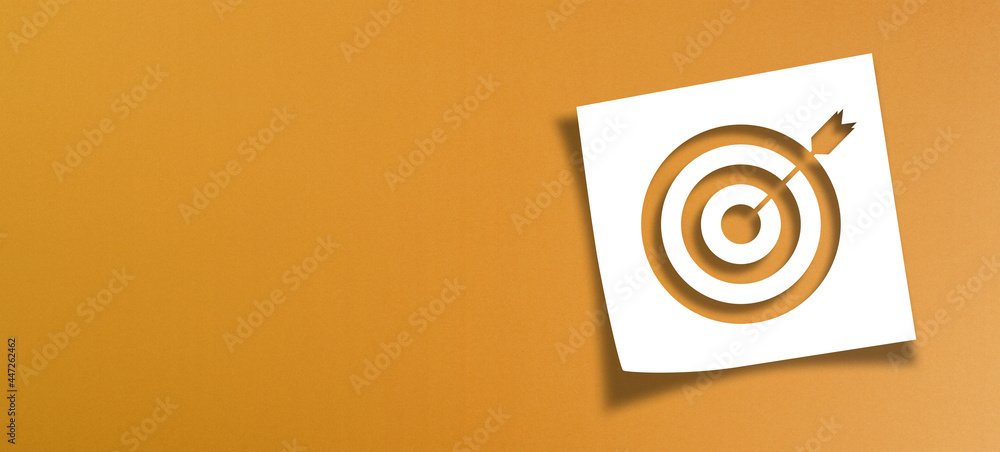 Poster note paper and target sign with copy space on panoramic orange background