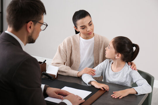 Mother And Daughter Having Meeting With Principal At School