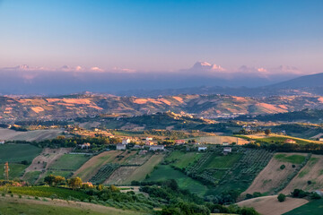 Beautiful sunset on the countryside of Marche in a summer evening