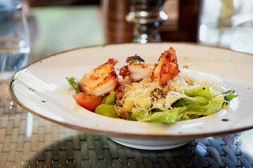 Caesar salad with shrimp or prawn. Gourmet seafood, healthy eating, healthy lifestyle concept.