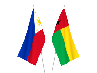 National fabric flags of Philippines and Republic of Guinea Bissau isolated on white background. 3d rendering illustration.