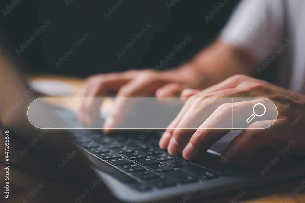 Fototapete SEO Data Search Technology Search Engine Optimization. man's hands are using a computer laptop to find what they are interested in. Searching for information with your website. internet networking.