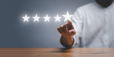 businessman touching on Five stars rating on virtual screen, positive customer Experience feedback...