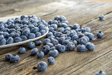 Fresh blueberries on rustic table. Bilberry on wooden Background.Concept for healthy eating