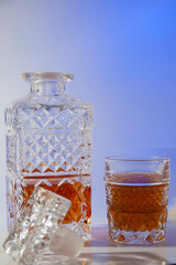 Alcoholic drink in a beautiful old glass and decanter