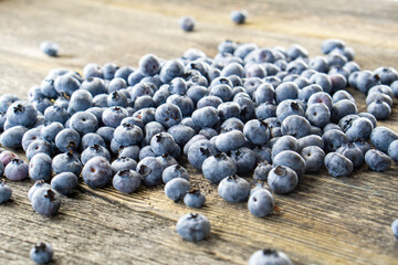 Fresh blueberries on rustic table. Bilberry on wooden Background.Concept for healthy eating