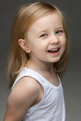 Adorable kid laughing during the photo session