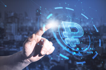 Male hand pointing at glowing ruble interface on blurry night city background. Currency and online banking concept. Double exposure.