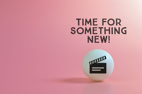 Clapperboard symbol with text TIME FOR SOMETHING NEW!