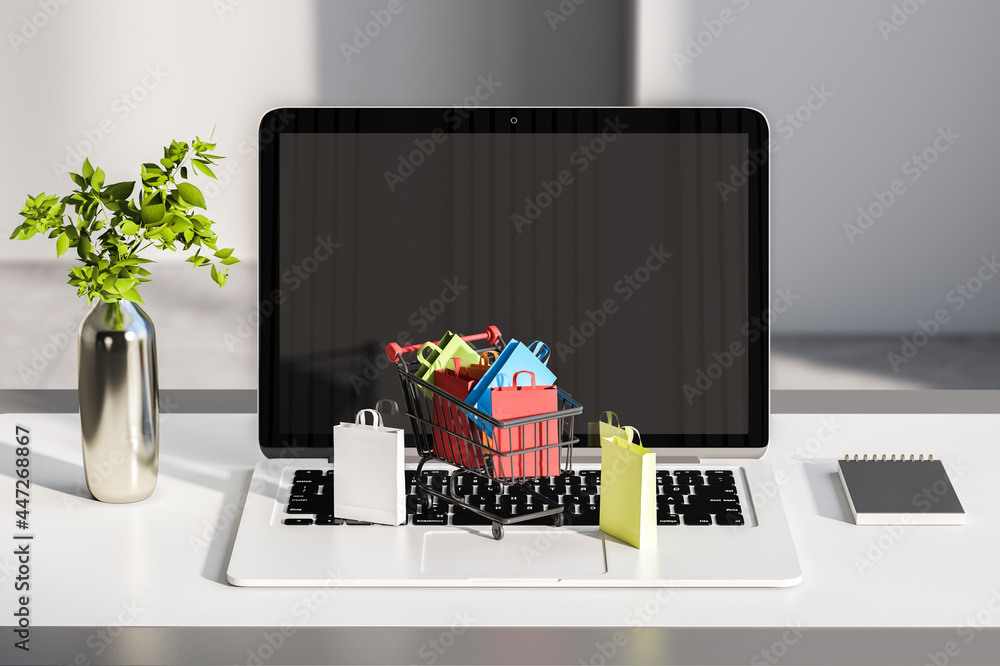 Poster close up of desktop with laptop and tiny shopping carts on keaybord. blurry wall background. online 