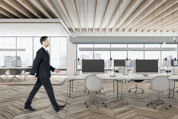 Businessman in suit walking in wooden conference room interior with city view, daylight, furniture and equipment. Design and ceo worker concept.