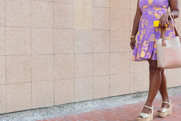 Unrecognizable woman walking down the street