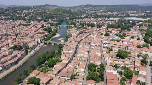 Aerial view of houses of Limoux old town and river Aude at sunny summer day, France