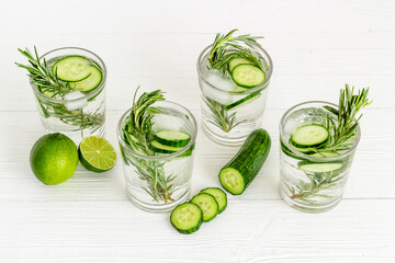 Lemonade with cucumber lime and herbs in glasses