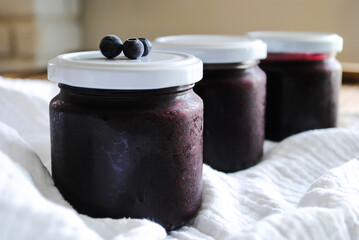 Blueberry jam. Sweet jam in a glass jar.
