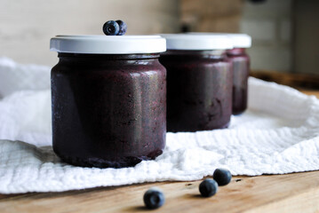Blueberry jam. Sweet jam in a glass jar.