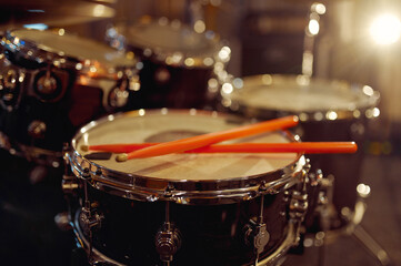 Professional drum kit and sticks closeup, nobody