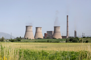 Fototapeta na wymiar Thermal power plant (TPP) Bobov dol with illegal burning of waste on june, 2021. TEC or TETs Bobov dol with high air pollution on a blue sky. RDF