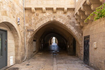 Tunnel passage under houses on the Habad street in the Christian quarter in the old city of Jerusalem, Israel