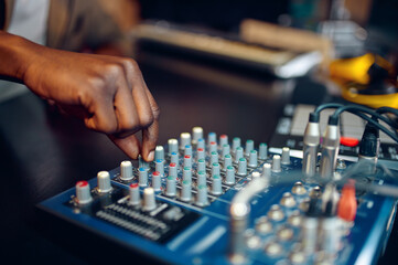 Happy male dj in headphones, recording studio