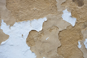 Sandstone Wall with White Plaster Flaking Off