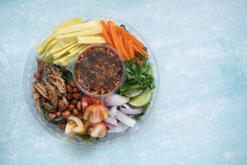 Spicy mango salad in box