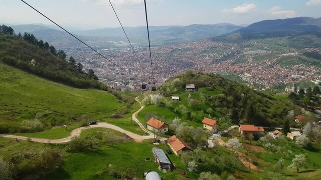Sarajevo Cable Car, City in background, lowering - (4K)