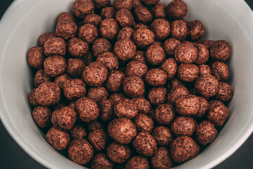 close up of a lot of chocolates balls in a bowl 
