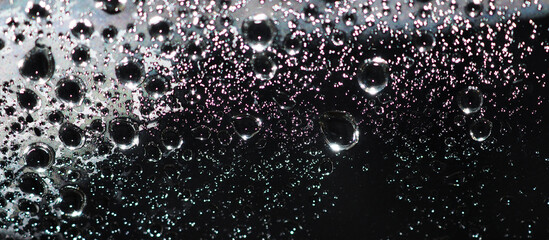 Close up of water drops on dark tone background. Abstarct wet texture with bubbles on window glass surface or grunge. Raindrop, Realistic pure water droplets condensed for creative banner design