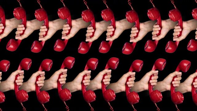 Hands holding red phones