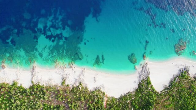 Aerial top down view of sandy beaches with blue water near Dhermi, Albania. Magnificent secret coves, a great place to relax in nature and privacy