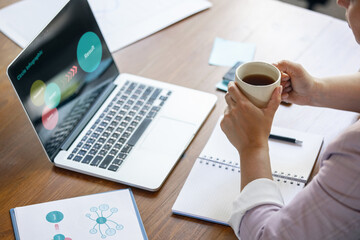 Young woman, manager working at office. Using laptop, modern gadgets. Remote working. Workplace at company, home with PC, devices.