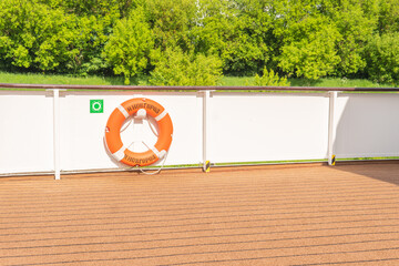 life-saving circle on deck sailing water yacht, cruise navigation sunny ransportation yachting people. Bow leaving hip tourists seascape cruise liner lifeboat lower deck drone