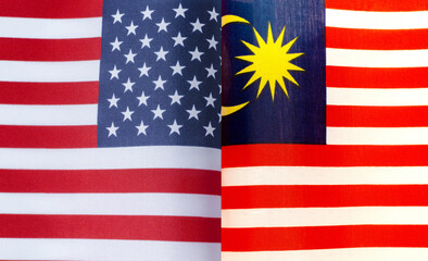 Fototapeta premium fragments of the national flags of the United States and Malaysia in close-up