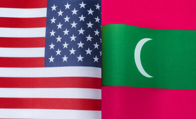 fragments of the national flags of the United States and the Maldives in close-up