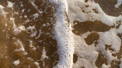 Natural background with sea wave and white foam
