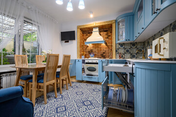 Modern classic luxurious kitchen and dining room, drawers and doors open