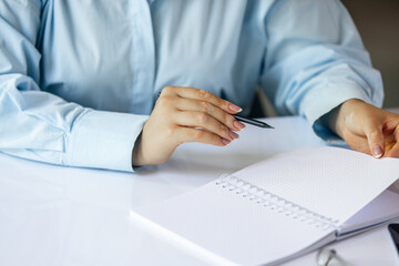 Close up of female hands signing business contract. Concept of female business, online education, professional occupation