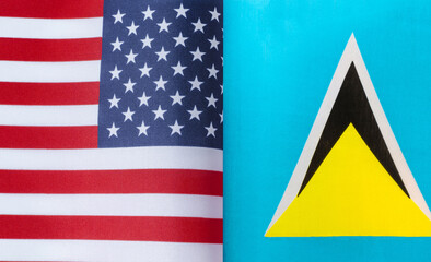 fragments of the national flags of the United States and Saint Lucia close-up