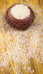 Uncooked dry rice in wooden bowl, Healthy food. Copy space.