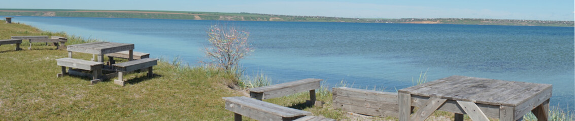 Picnic tables on the banks of the Tiligul estuary in the Odessa region.