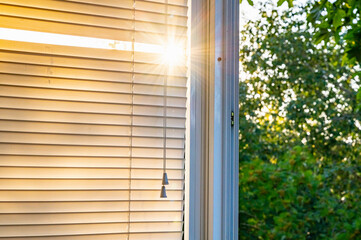 window blinds rays of the sun