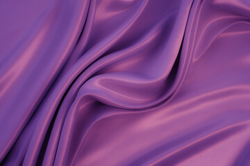Beautiful elegant wavy purple satin silk luxury cloth fabric texture with monochrome background design. Copy space